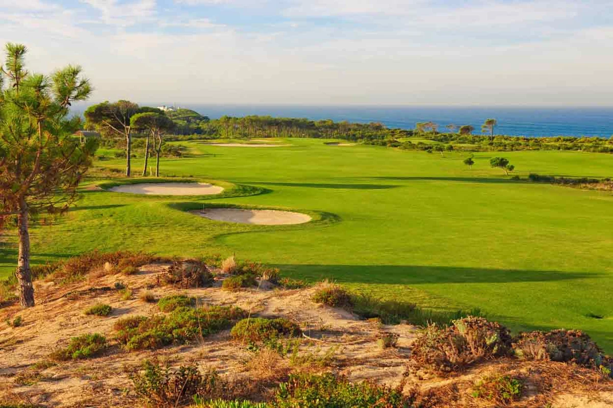 Sunlit coastal golf course at Oitavos Dunes, Portugal